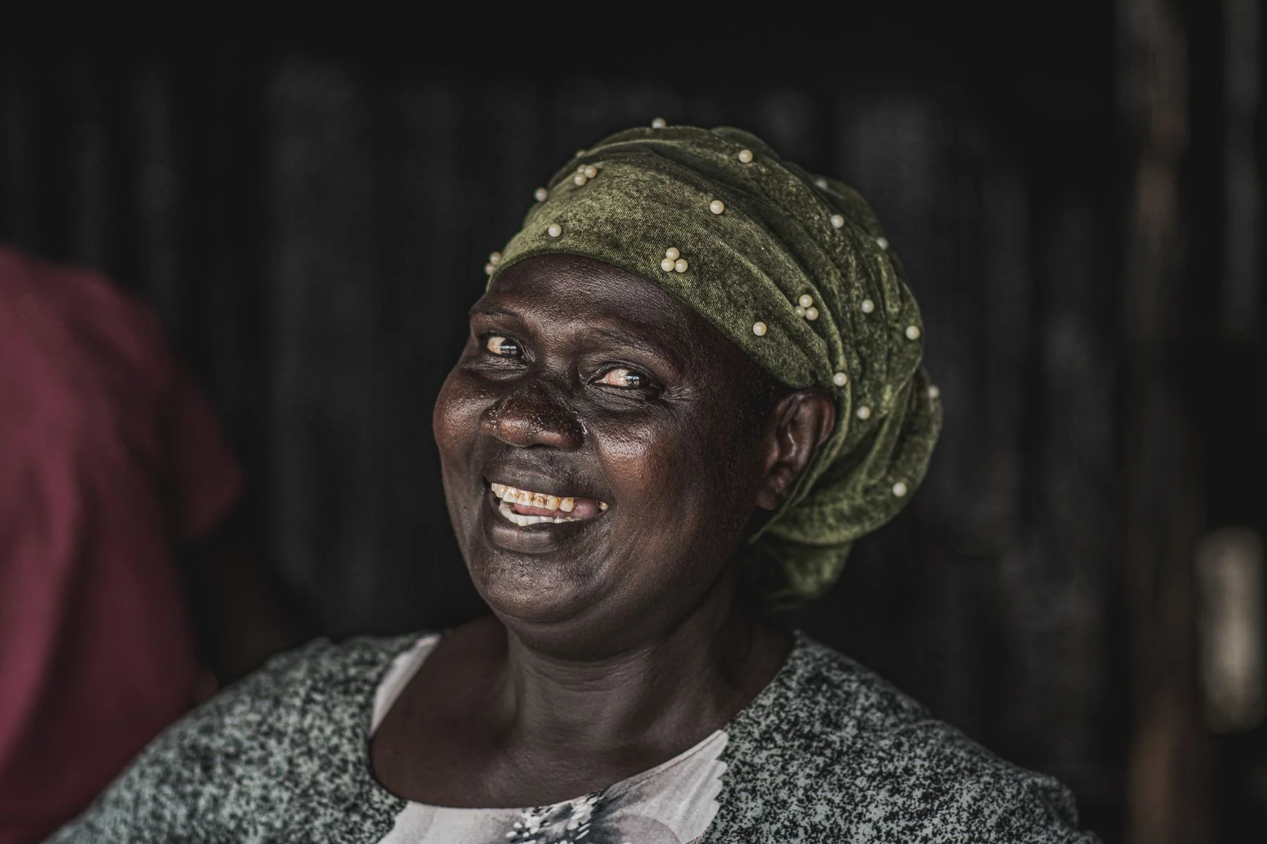 Smiling Kenyan woman in Nairobi; illustrative licensed photograph